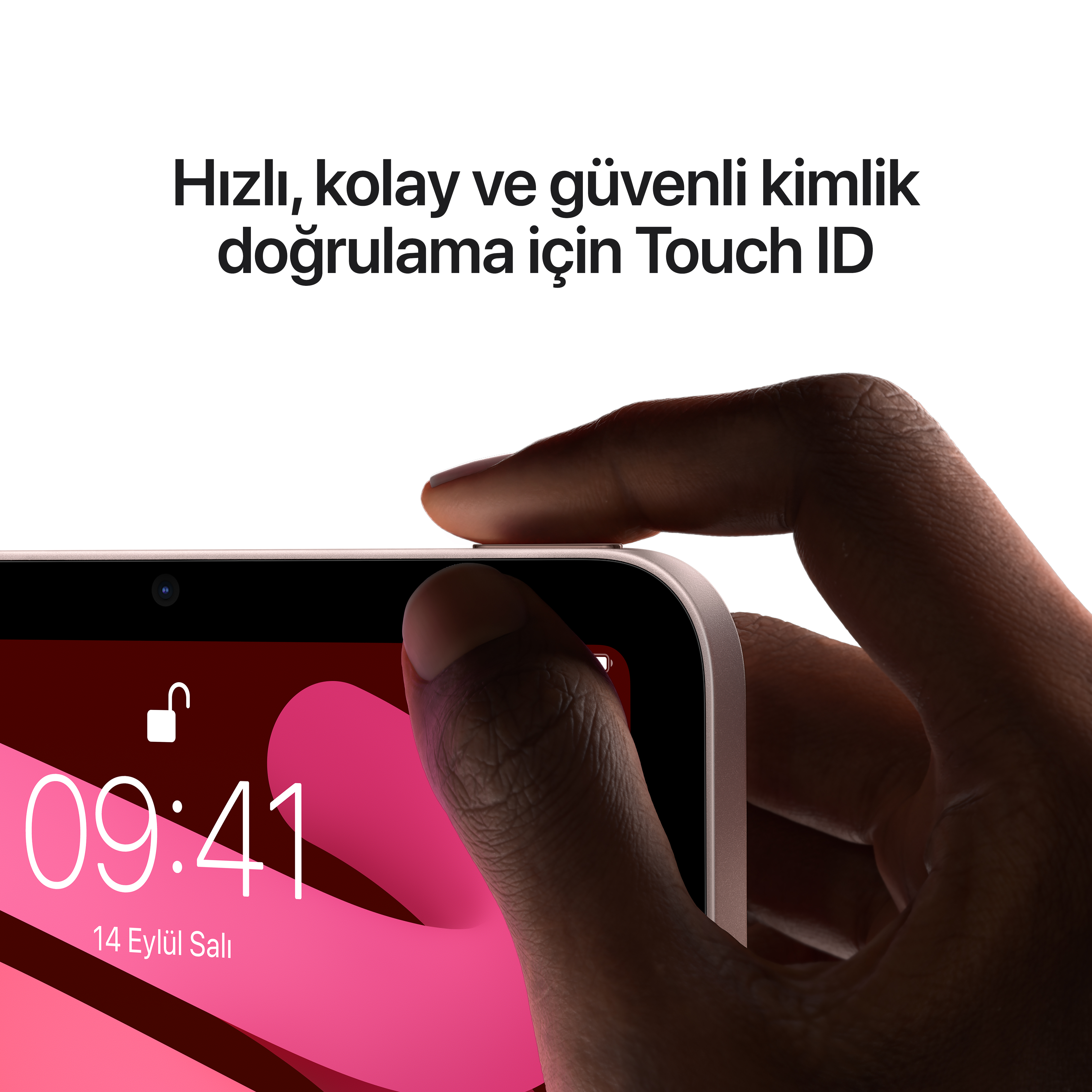 Pembe arka plan üzerinde iPhone'un Touch ID sensörünü kullanan bir elin yakın çekimi. Ürün çekimi.