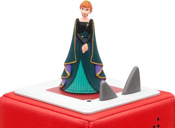 Une figurine d'Anna de La Reine des Neiges se tient sur une boîte rouge.