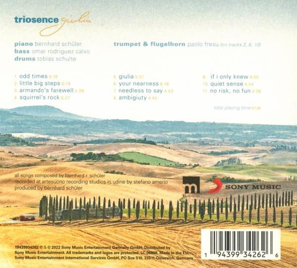 Die Rückseite einer CD-Hülle mit Text über das Album und Landschaftsbild.