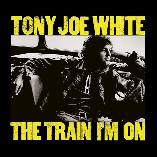 Pochette de l'album 'The Train I'm On' de Tony Joe White avec une palette de couleurs noire et jaune.