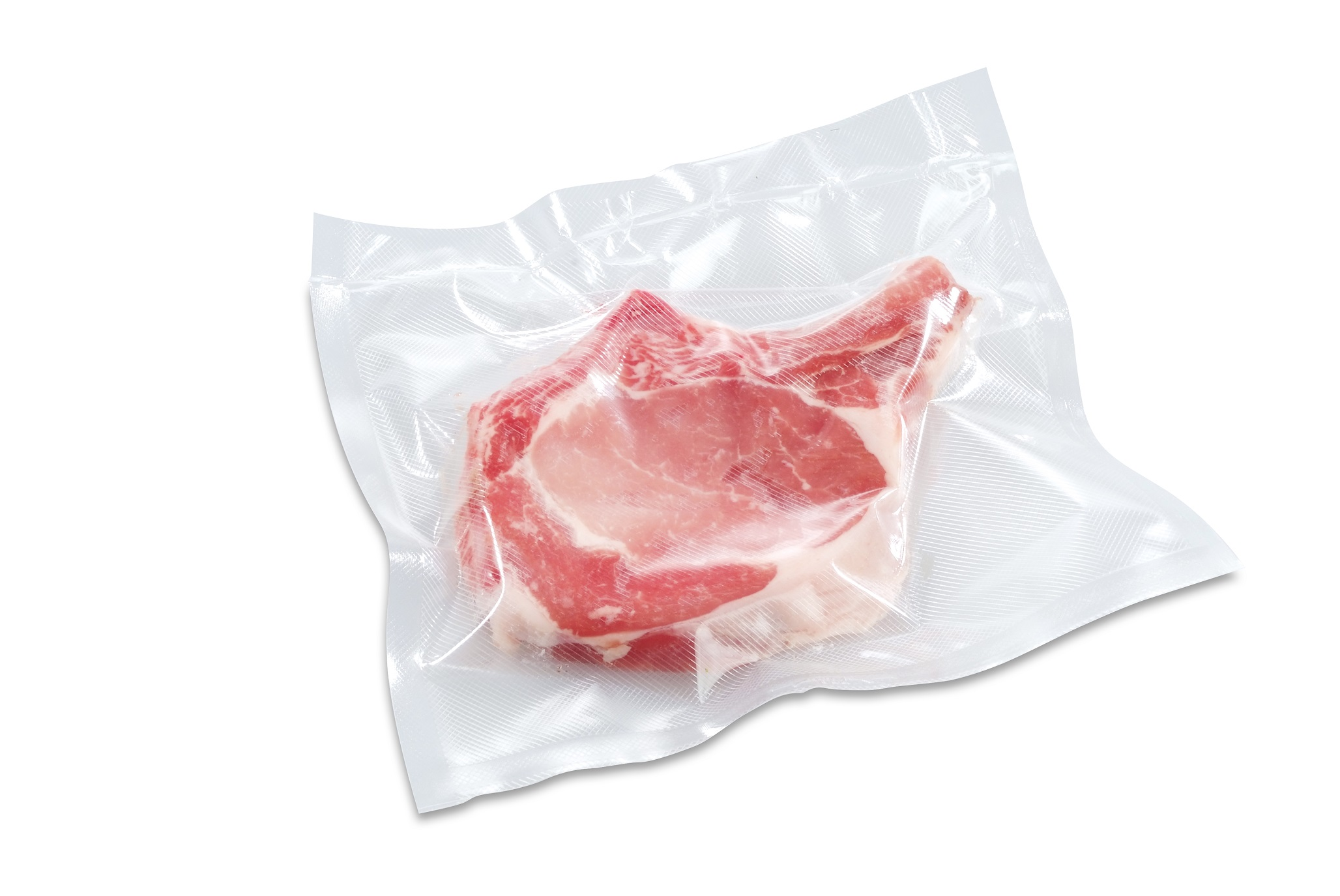 Raw pork chop in a clear vacuum-sealed bag on a white surface. The meat is pink and red.