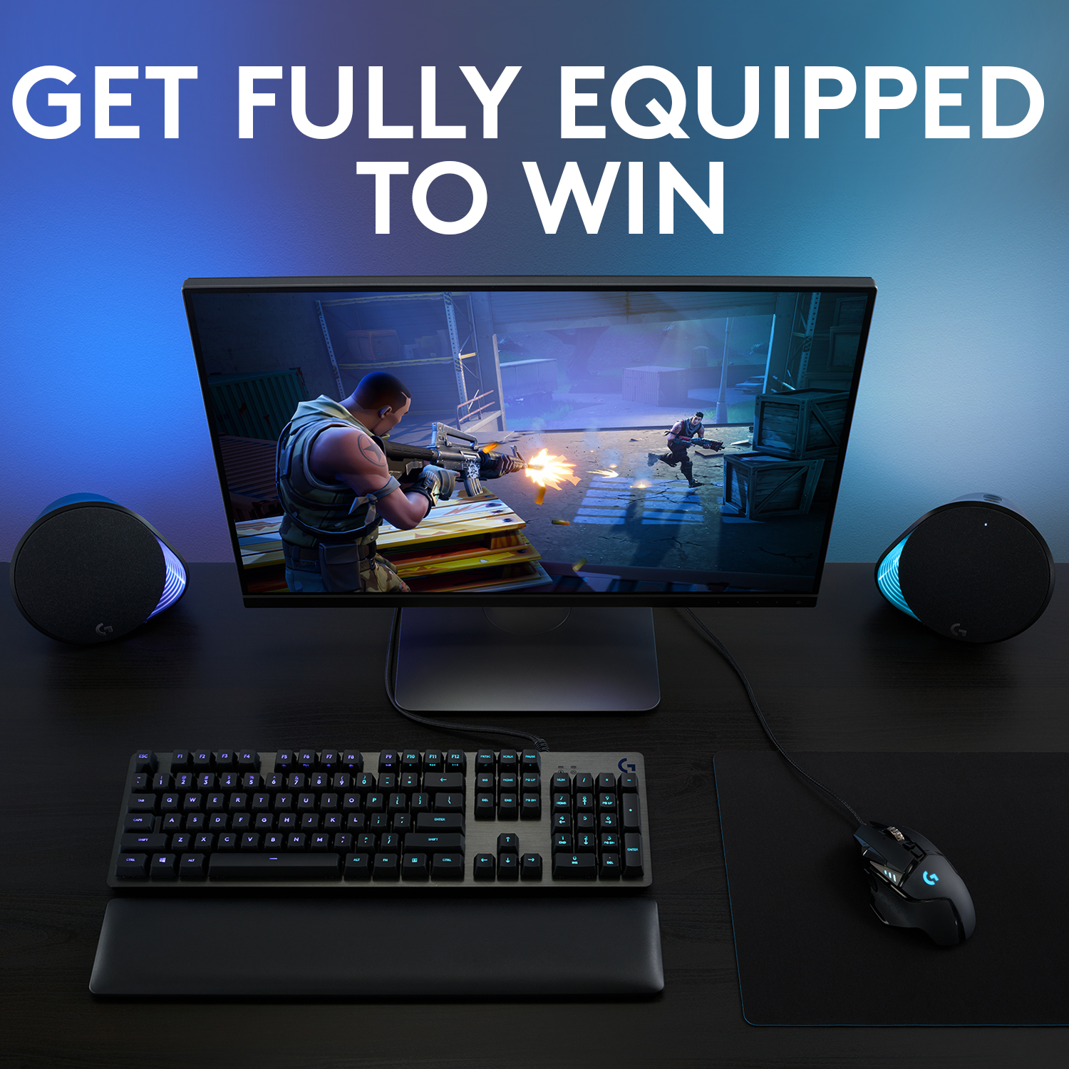 Gaming-Setup mit Monitor, Tastatur, Maus und Lautsprechern. Blaues und schwarzes Farbschema.