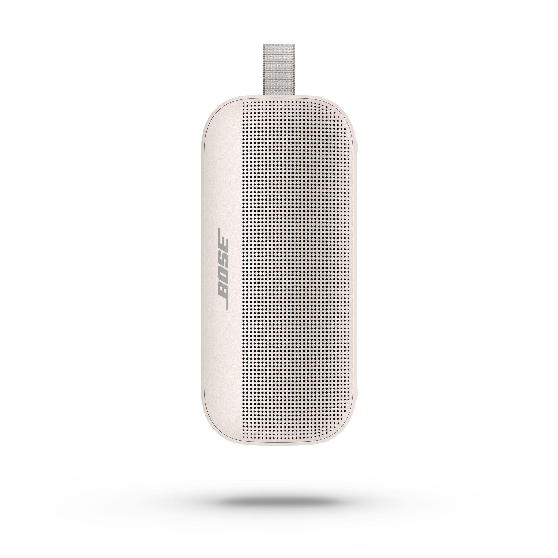 Ein cremefarbener Bose-Lautsprecher mit grauem Griff und perforierter Front.