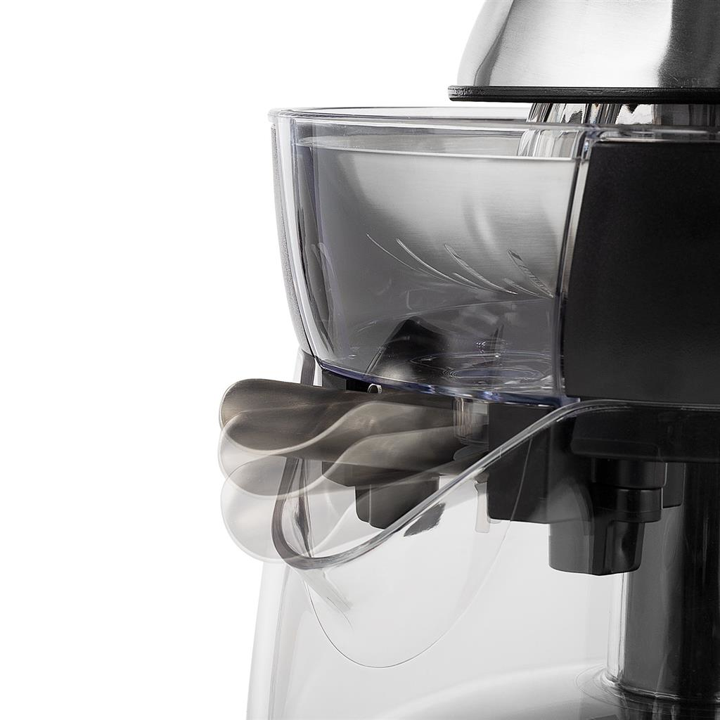 Gros plan d'un appareil de cuisine. Un récipient transparent avec des lames est visible, montrant la fonction de l'appareil.