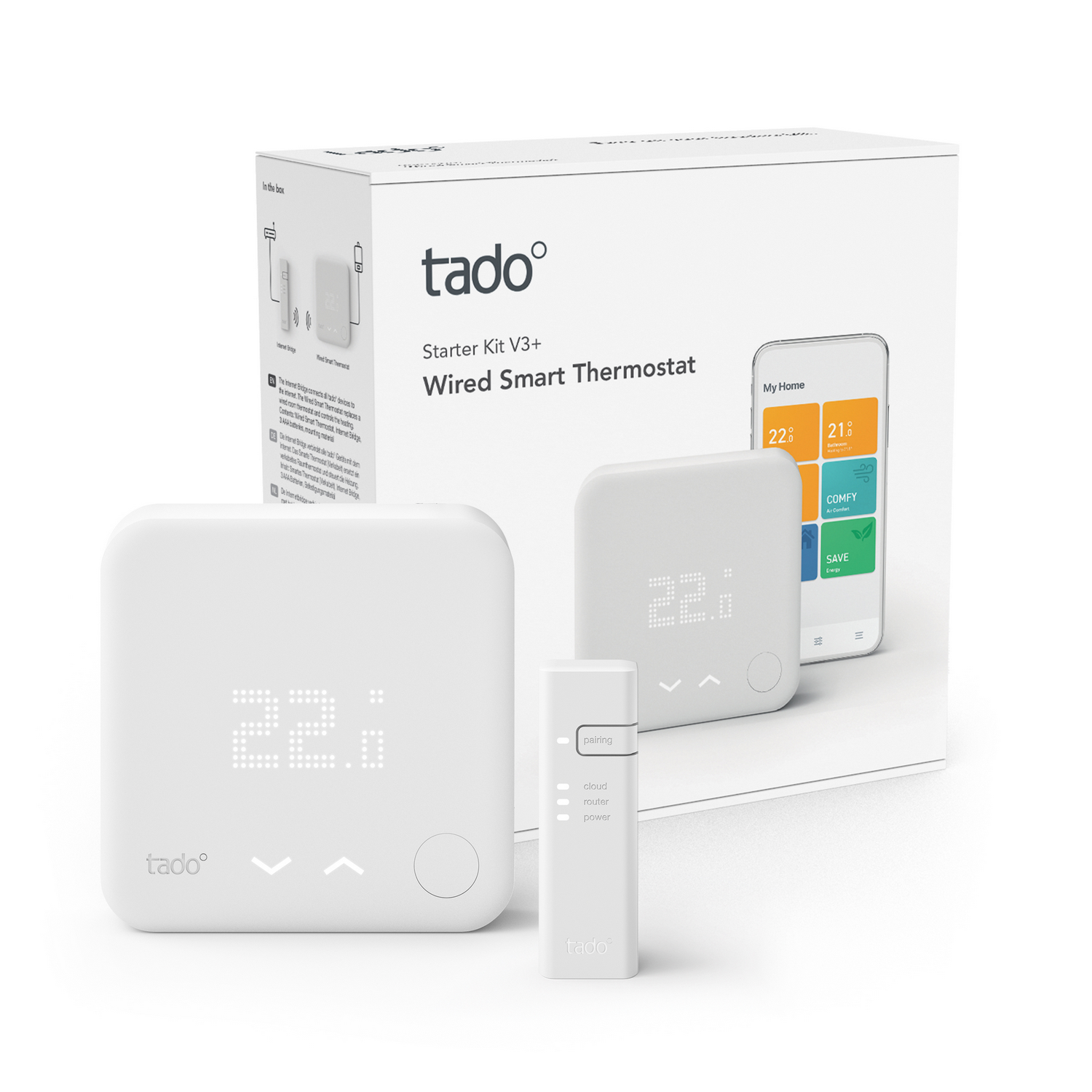Un kit de termostato inteligente Tado blanco con un termostato, un panel de control y una caja con un teléfono.