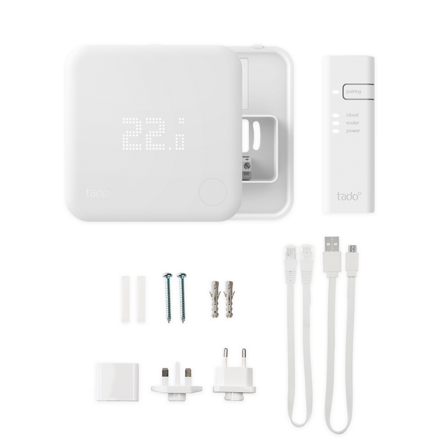 Juego de termostato inteligente blanco con panel de control, mando y accesorios.