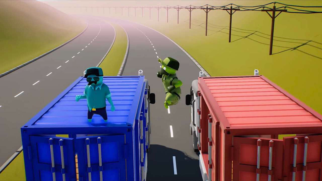 Due figure su container. Uno salta, uno è in piedi. Strada sullo sfondo.