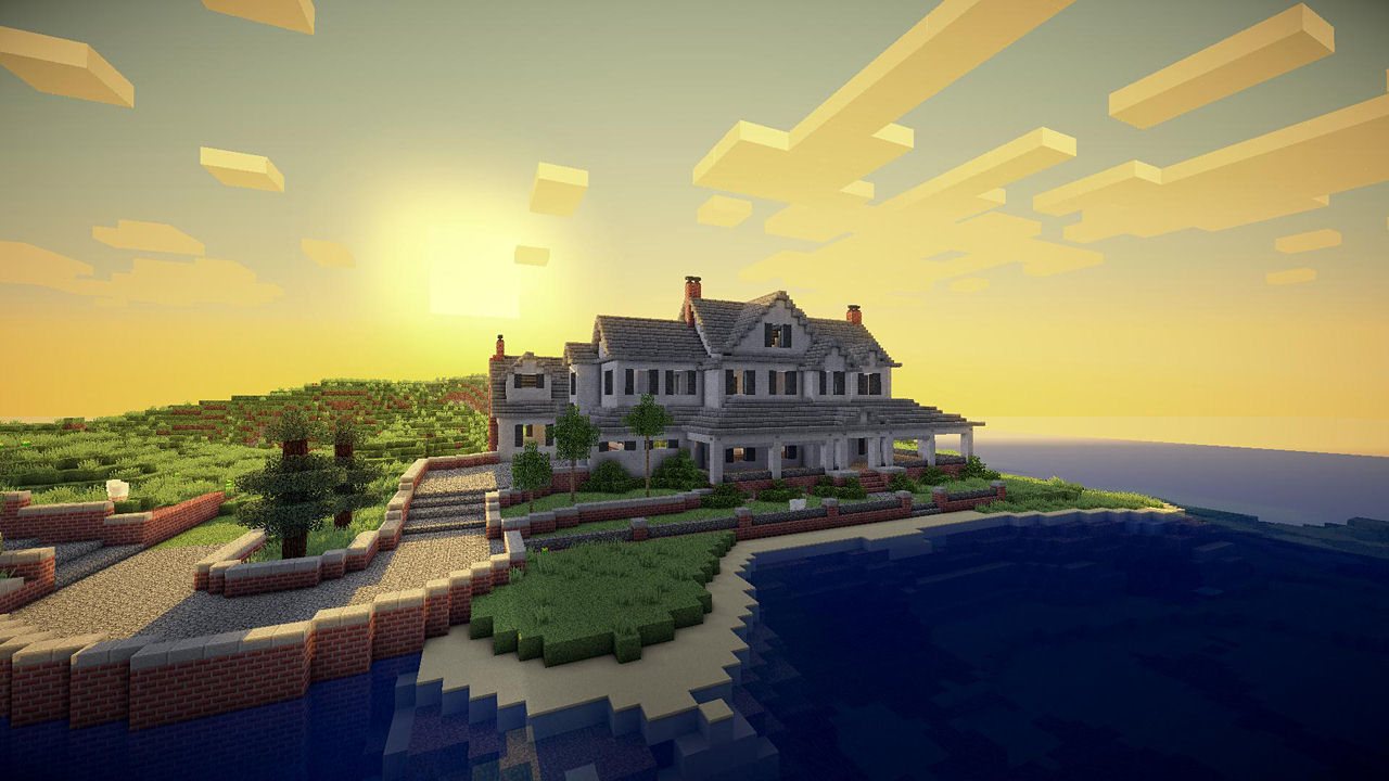 Una scena di Minecraft di una grande casa su una piccola isola al tramonto. L'acqua è blu.