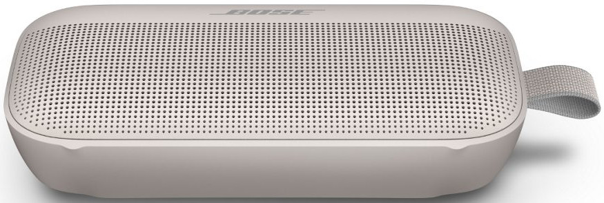 Haut-parleur Bose beige. Rectangulaire avec grille en tissu et sangle.