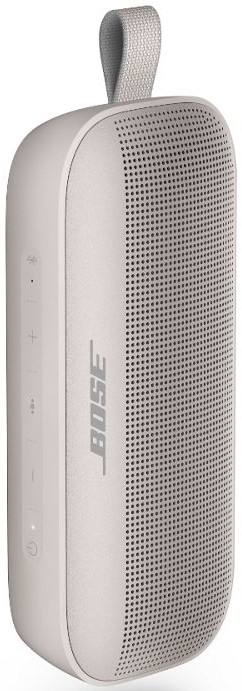 Une enceinte portable Bose gris clair avec une poignée en tissu et des boutons de commande.