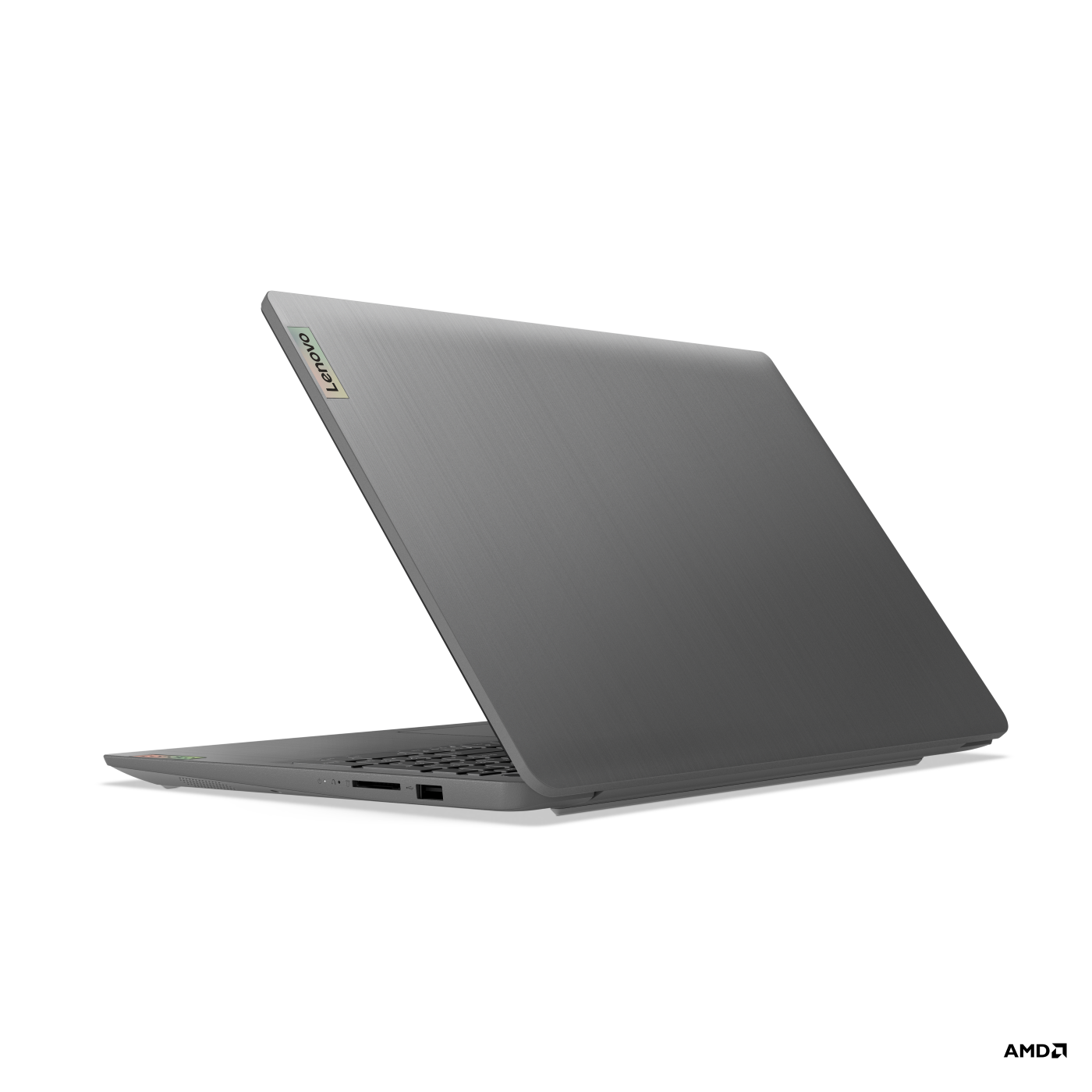 Siyah bir arka plan üzerinde, hafifçe açık gri dizüstü bilgisayar, klavyeyi gösteriyor.