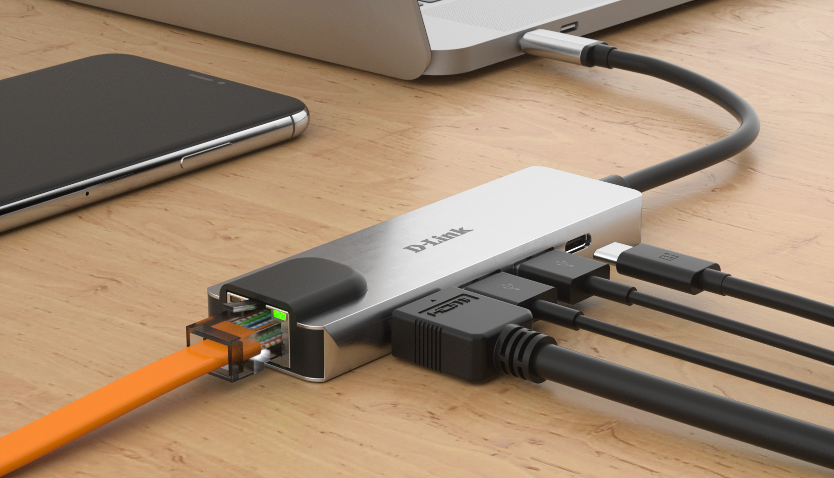 Ezüst D-Link hub laptophoz és telefonhoz csatlakoztatva, különböző kábelekkel.