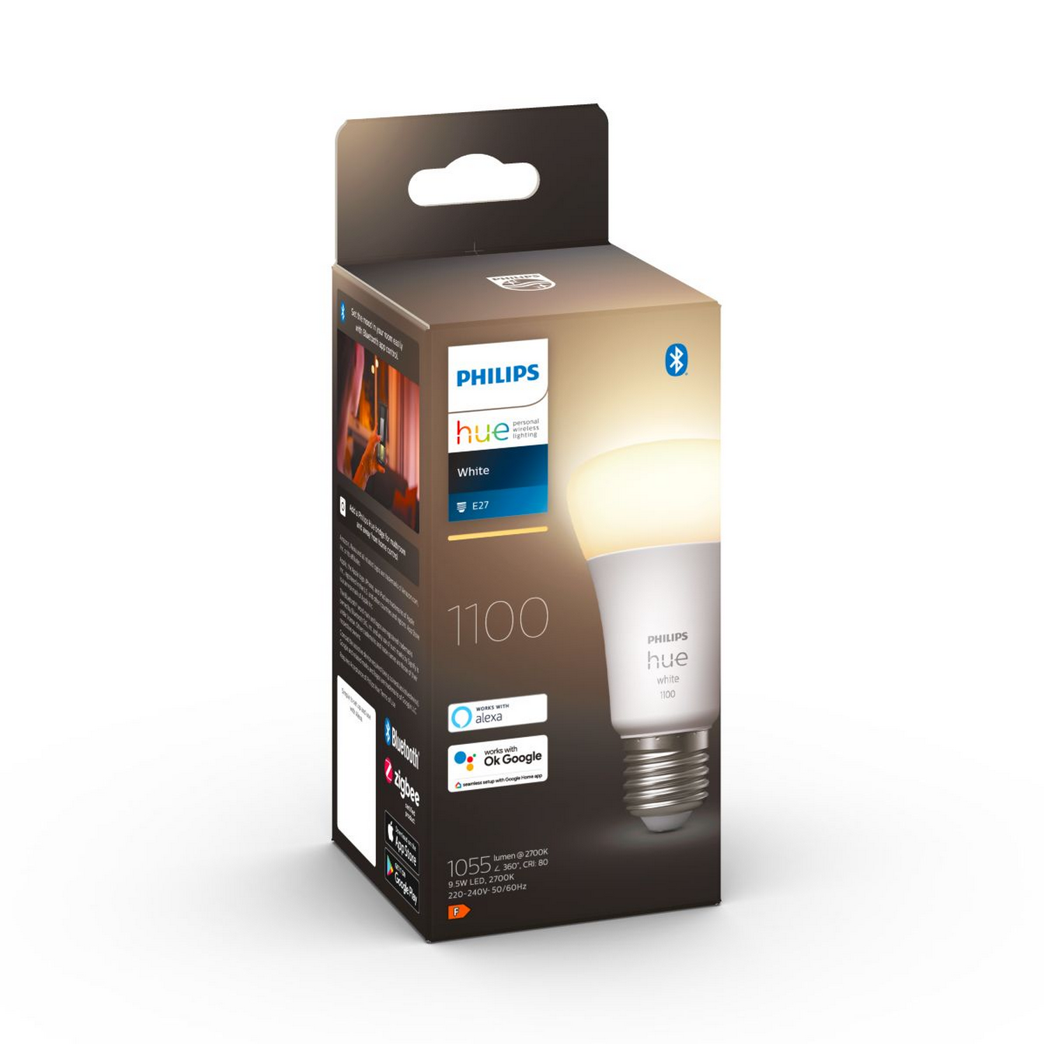 Bombilla Philips Hue en una caja, con luz que emite de la bombilla.