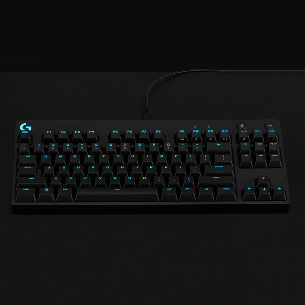 Black keyboard with blue backlit keys, top view.