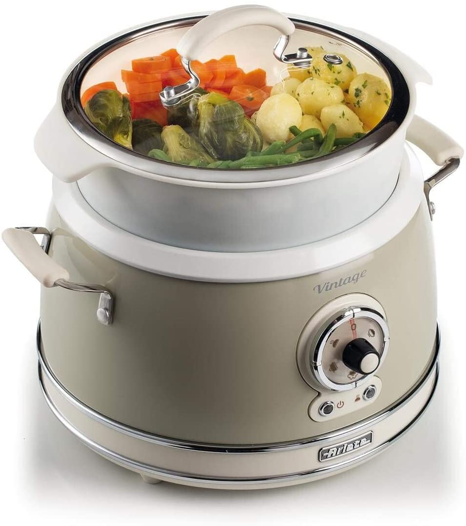 Cuiseur vapeur de style vintage avec des légumes à l'intérieur et un couvercle transparent.