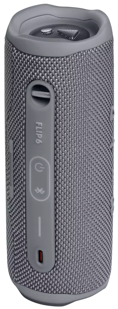 Een grijze JBL Flip 6-luidspreker met knoppen aan de zijkant.