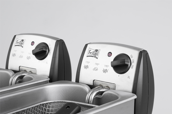 Two silver deep fryers side by side. Each has a control panel and a basket inside.
