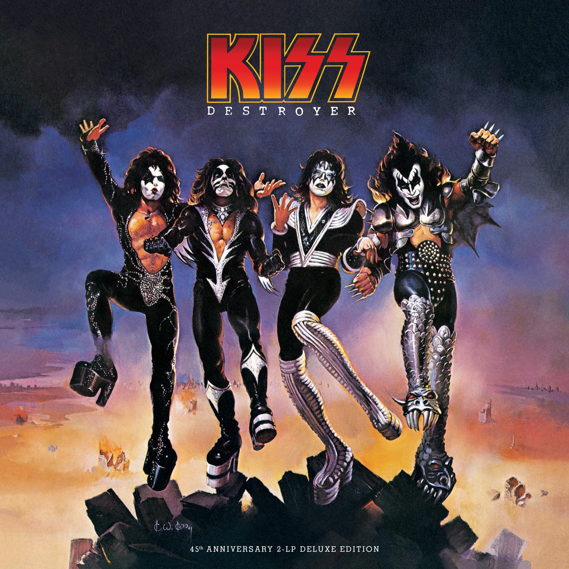 A KISS együttes jelmezekben és sminkben pózol sziklás tájon.