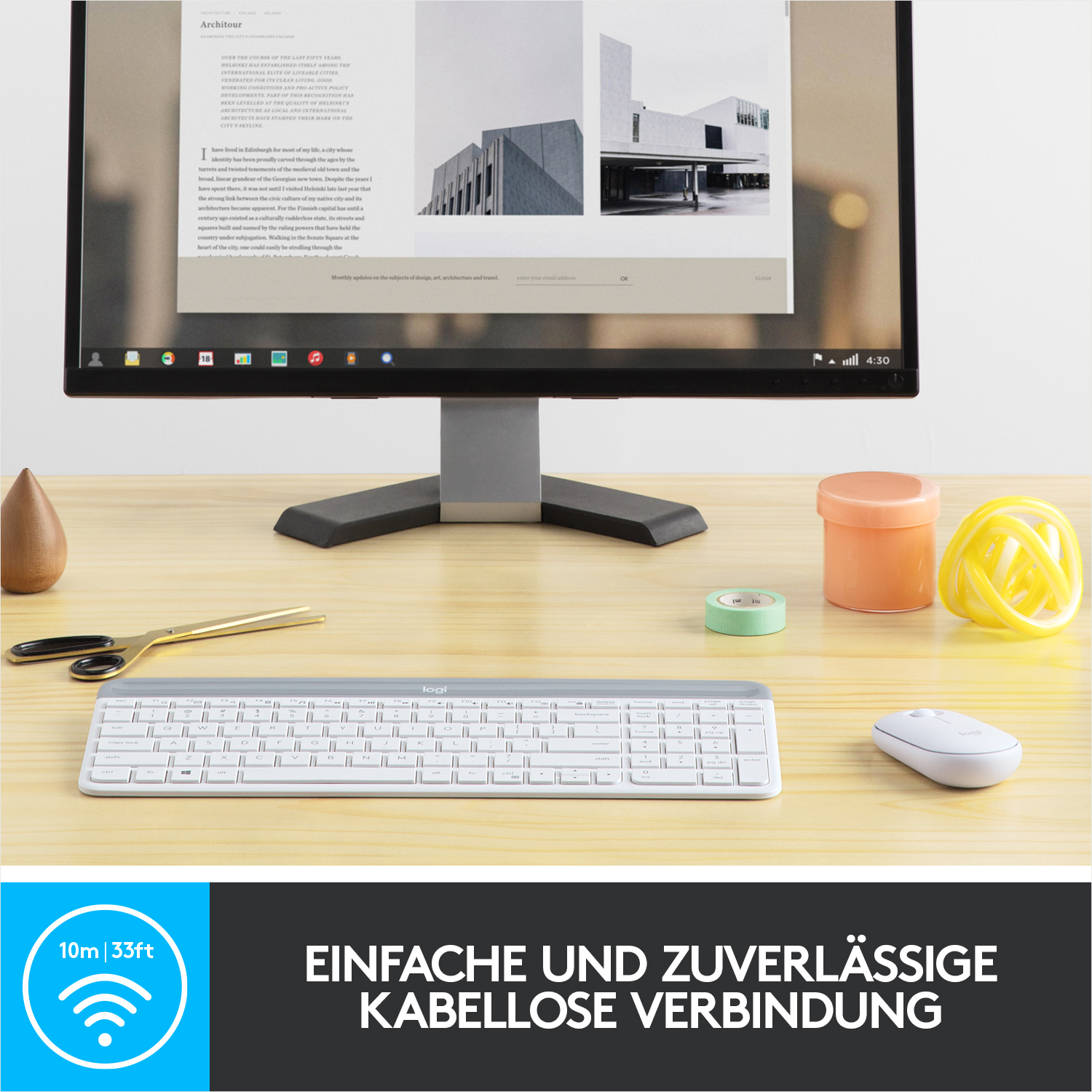 Ein Schreibtisch-Setup mit Monitor, Tastatur, Maus und einigen Schreibtisch-Accessoires.