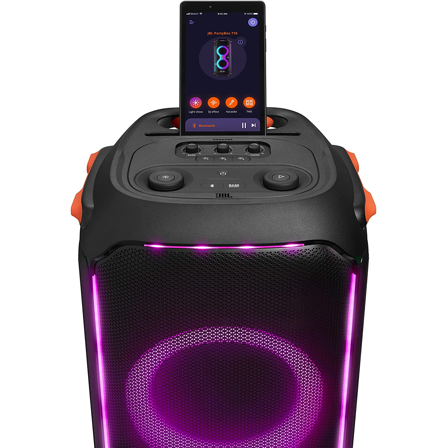 Altavoz JBL PartyBox negro con un teléfono encima, luces brillantes.