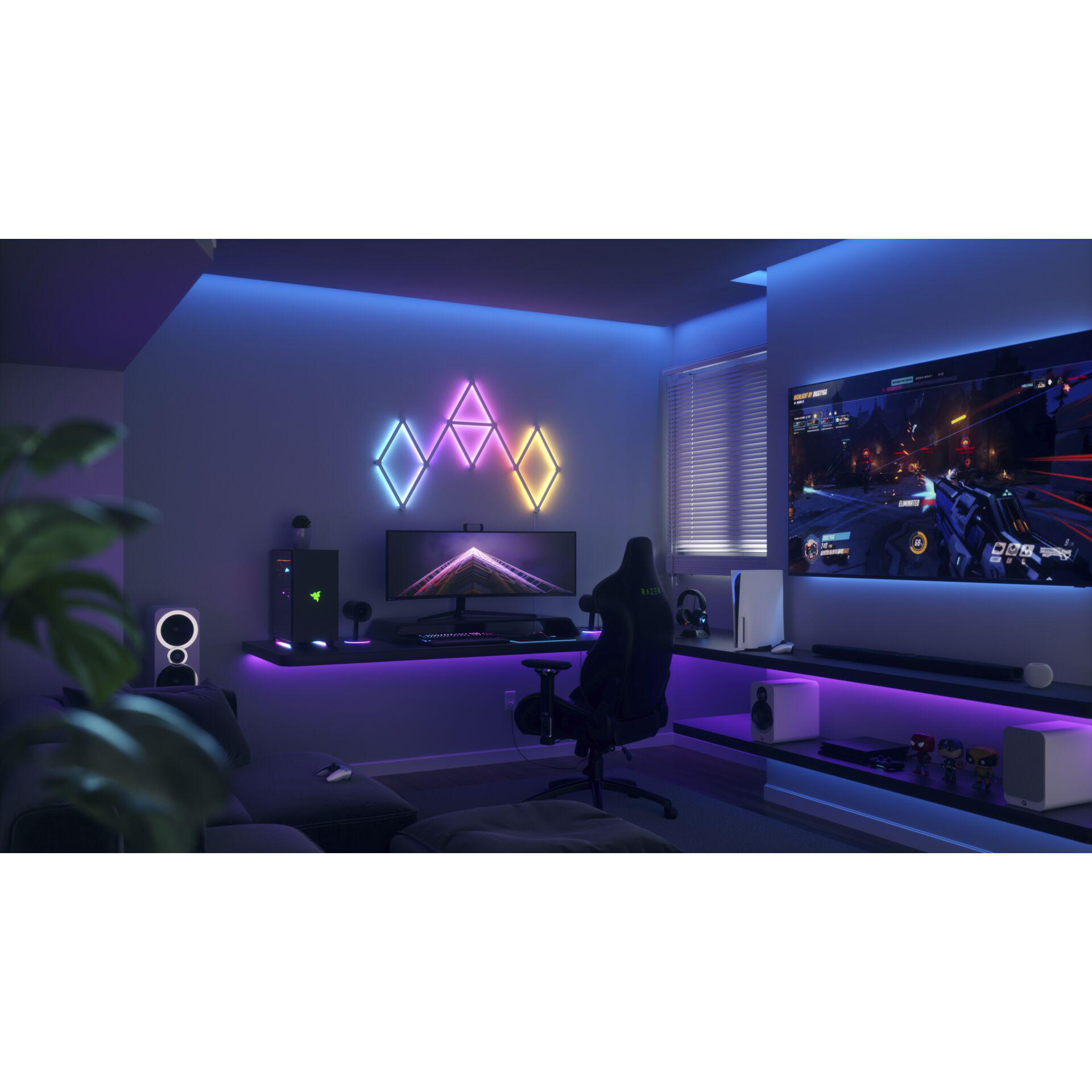 Gaming-Zimmer mit Neonlichtern, Gaming-Setup mit Fernseher, Schreibtisch und Stuhl.