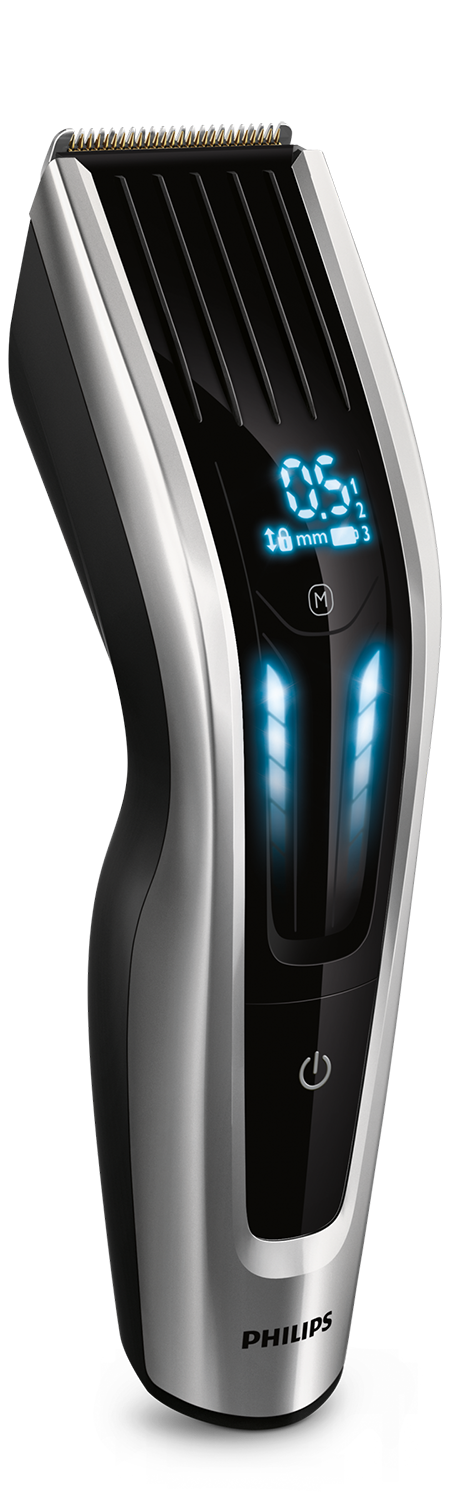Een zwarte en zilveren Philips tondeuse. Digitaal display toont instellingen. Zwarte achtergrond.