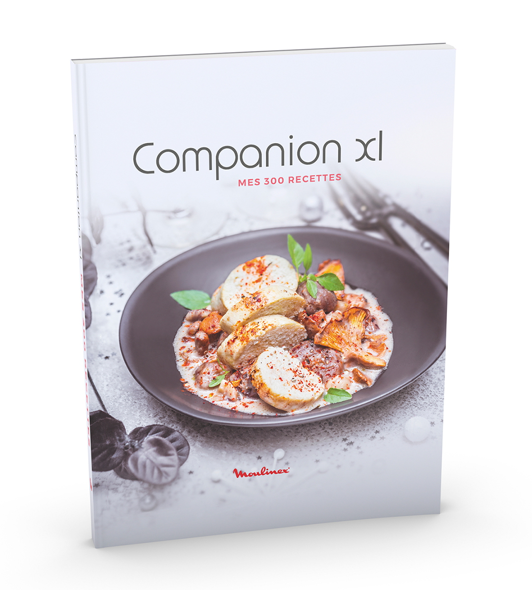 Un livre de cuisine intitulé 'Companion xl' avec de la nourriture dans une assiette sur la couverture.