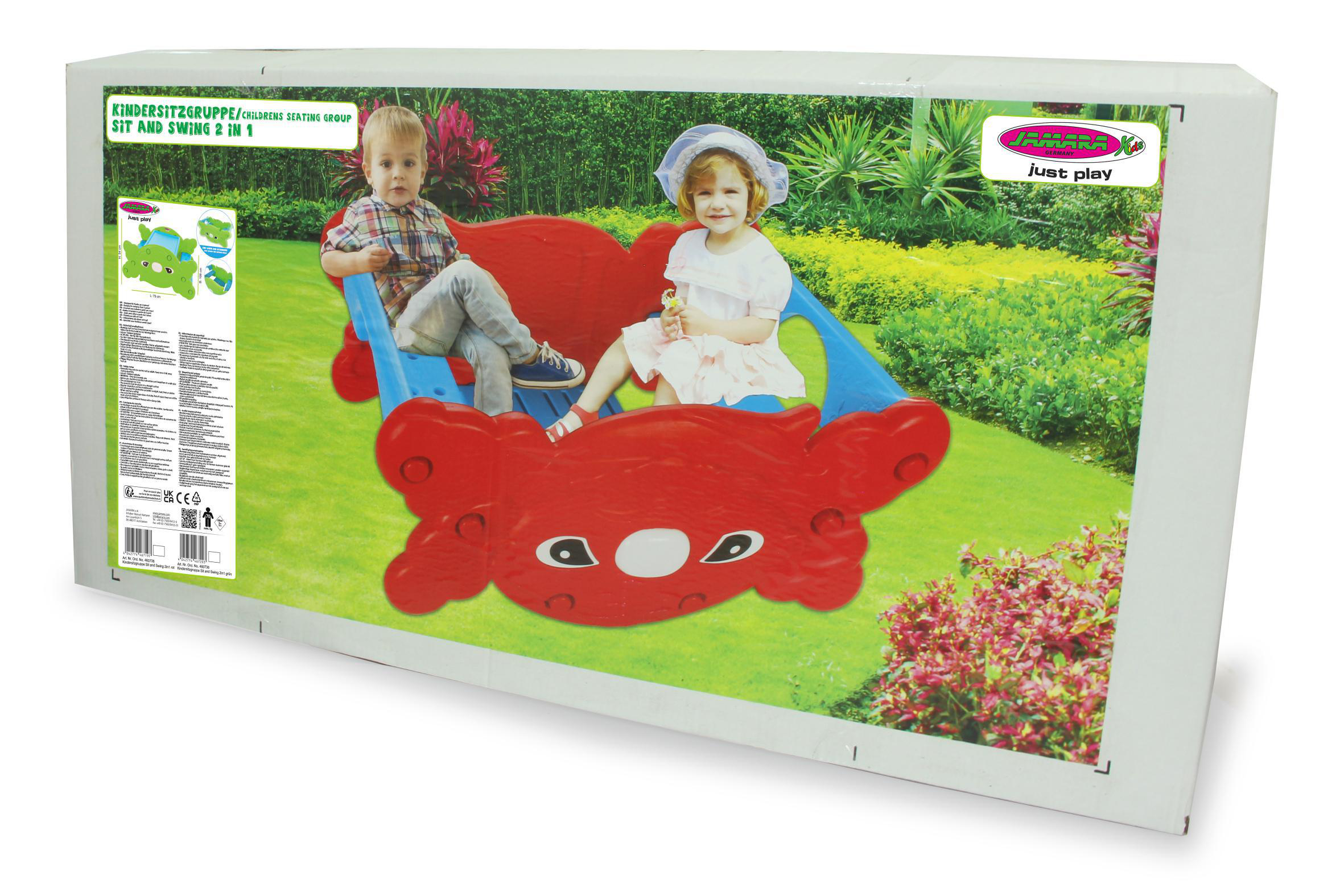 Box zeigt eine krabbenförmige Schaukel. Zwei Kinder sitzen auf einem grünen Feld darauf.
