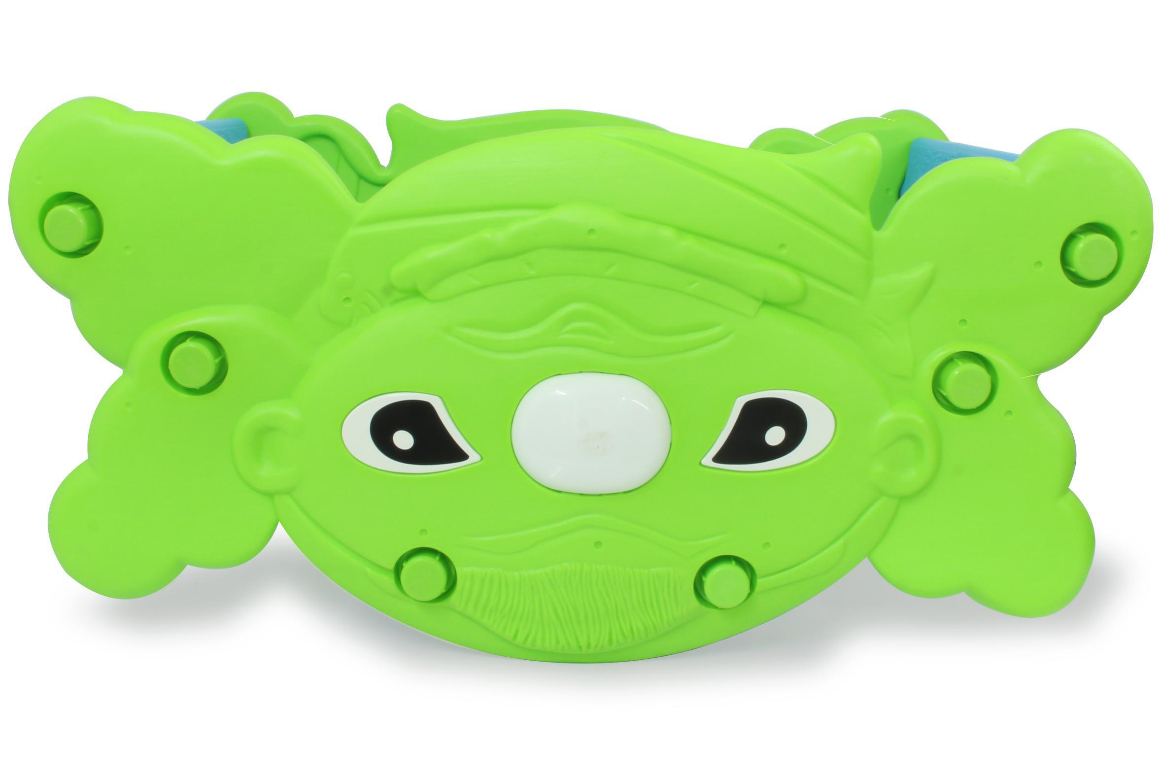 Grünes Plastikspielzeug in Form eines Cartoon-Gesichts mit Augen, Mund und Haaren.