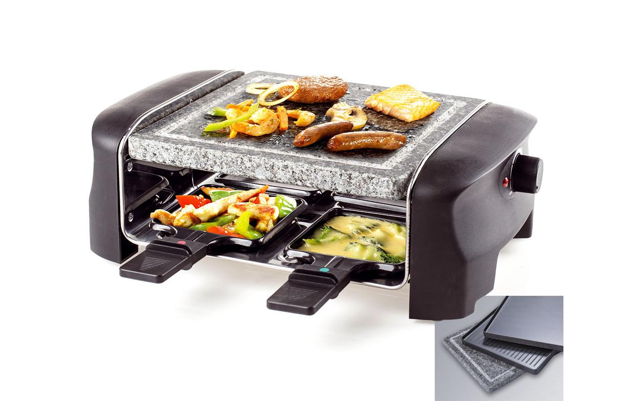 Raclette-Grill mit Speisen in den Schalen und auf dem Grill, schwarz und grau.