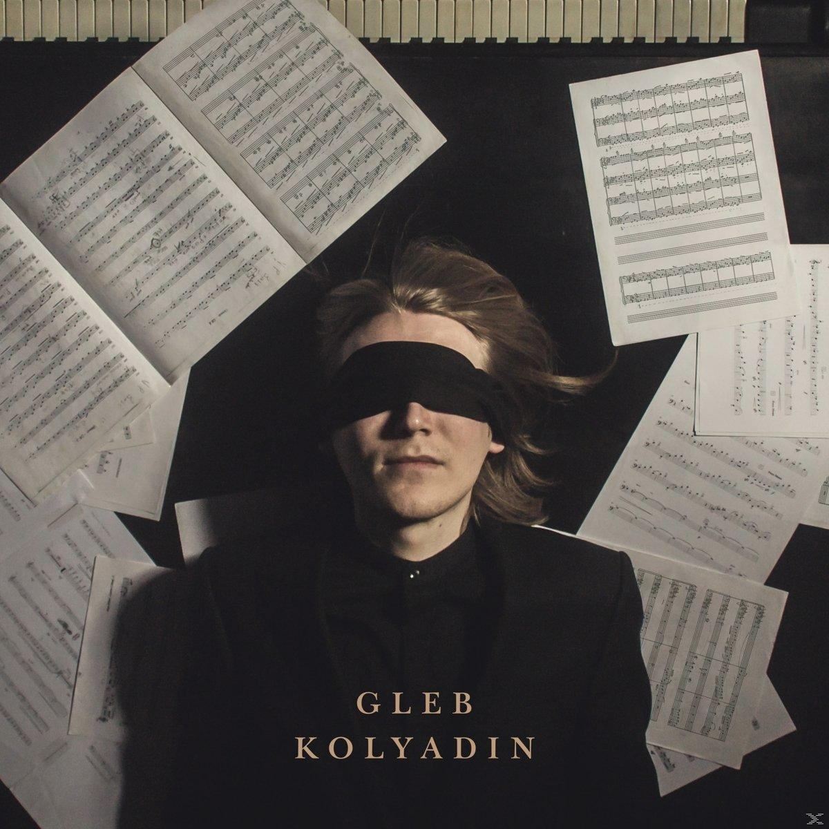 Mann mit Augenbinde, umgeben von Notenblättern. Text: Gleb Kolyadin.