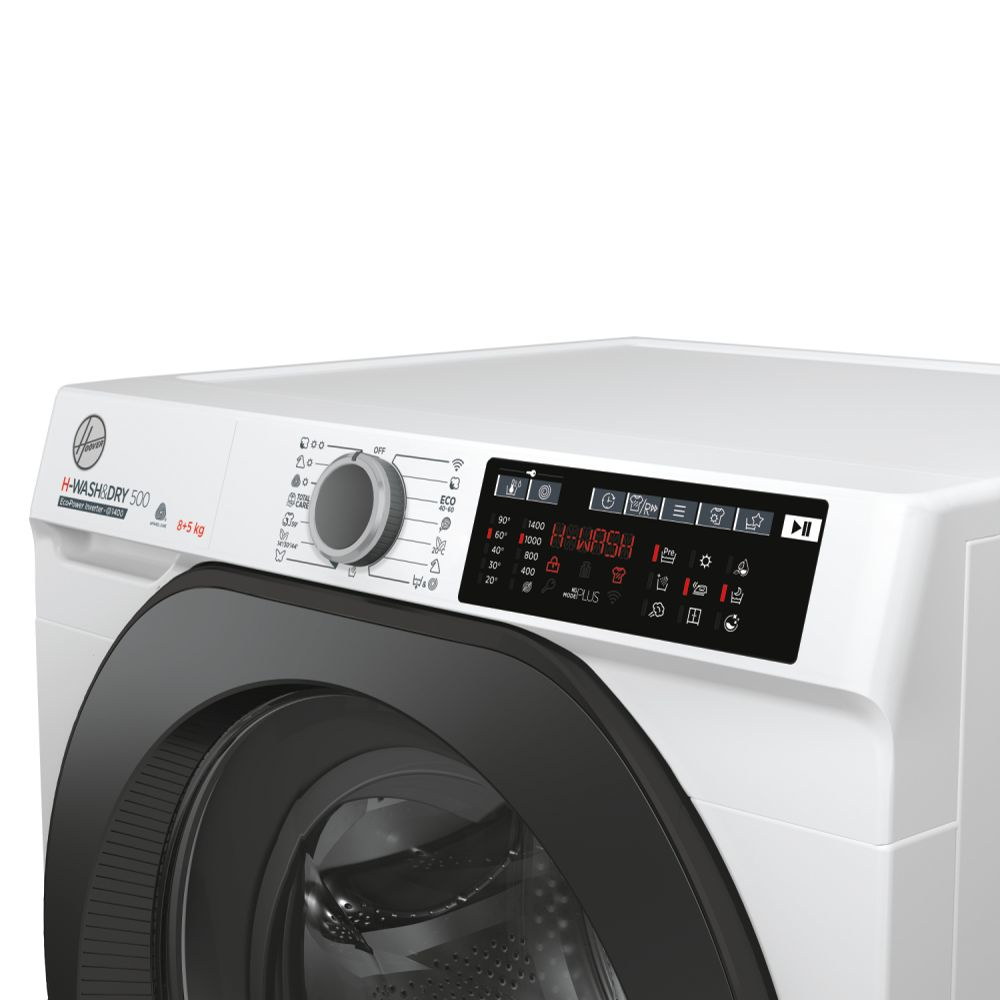 Gros plan sur le panneau de commande et la porte d'un lave-linge blanc.