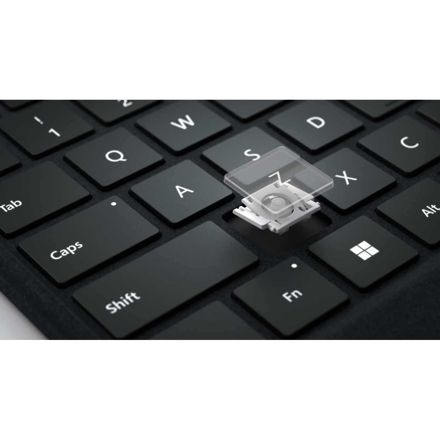 Primer plano de un teclado con una tecla quitada.