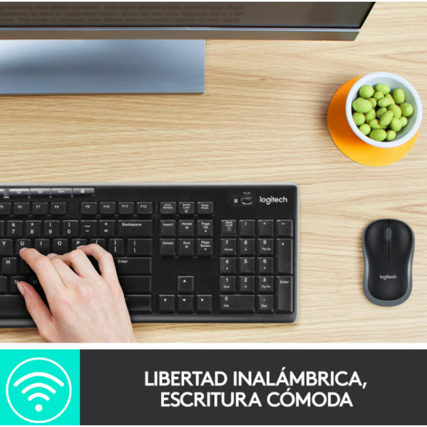 Teclado, ratón y monitor negros con texto: Libertad inalámbrica, escritura cómoda.