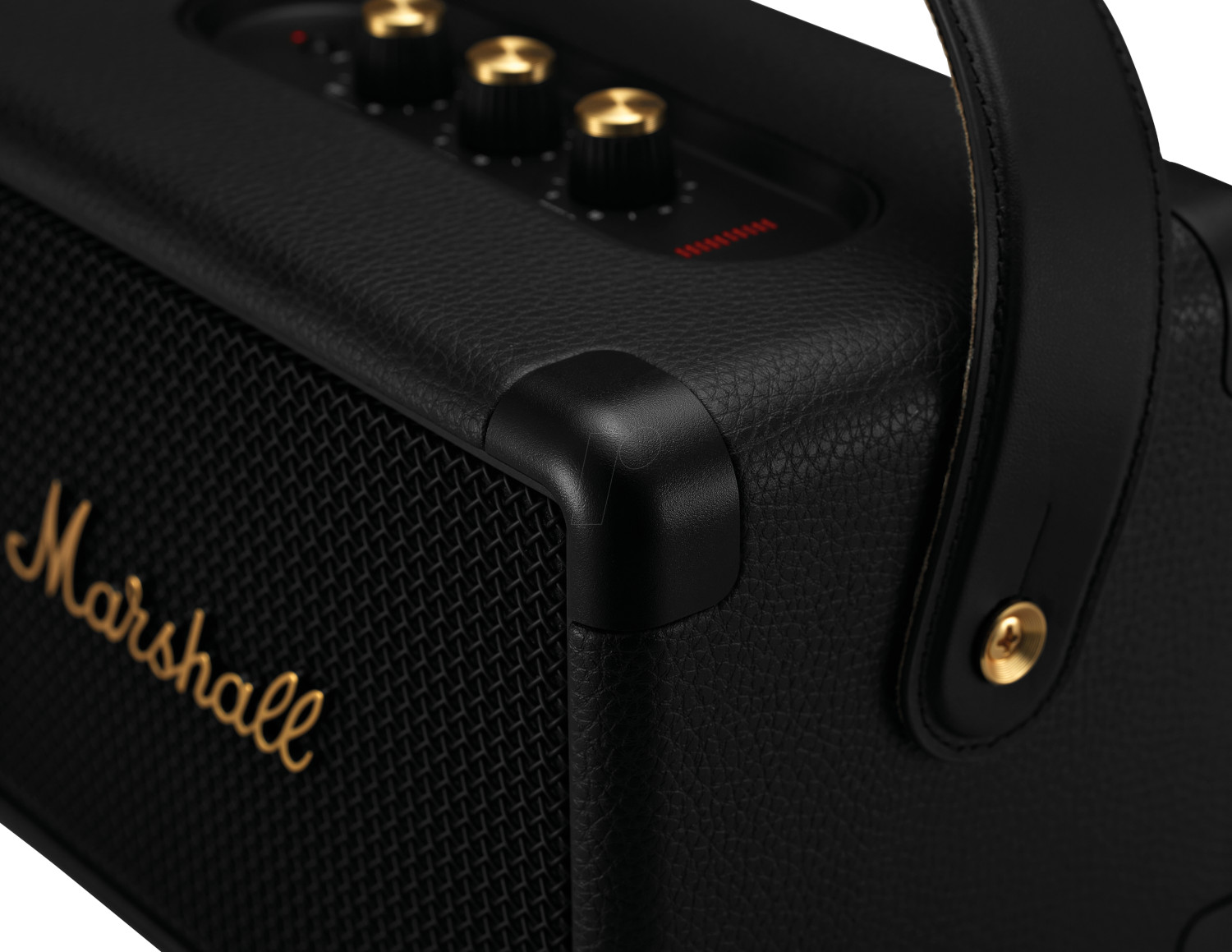 A black Marshall speaker, showing the corner with the Marshall logo and leather handle, close-up.