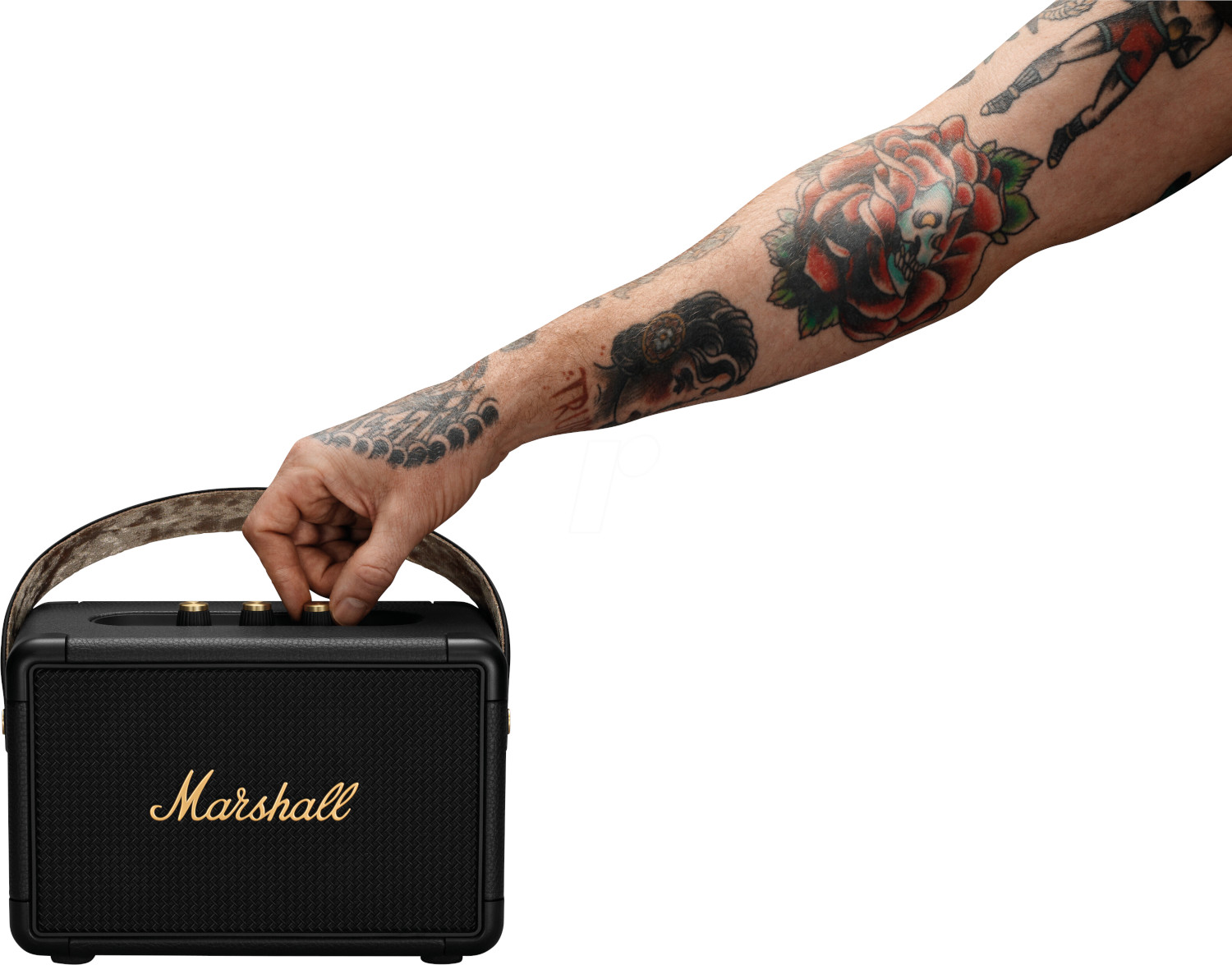A person with tattoos holds a black Marshall speaker with a strap.