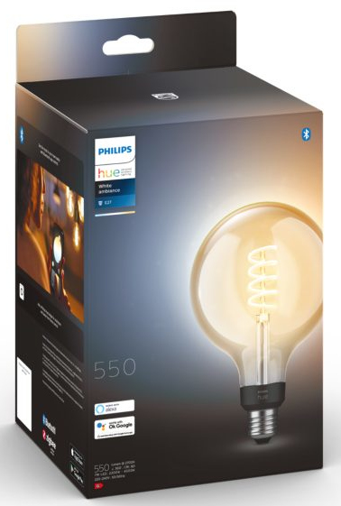 A light bulb box with a Philips Hue bulb. The bulb is lit and has a spiral filament.