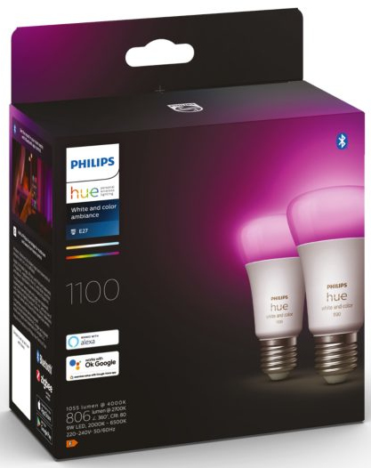 Box of Philips Hue smart bulbs. Two bulbs are lit with pink light.