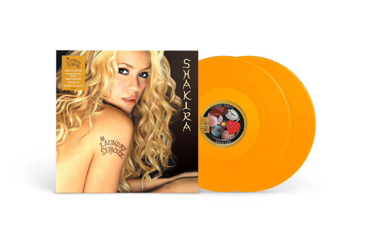 Pochette de l'album 'Laundry Service' de Shakira avec deux vinyles orange.