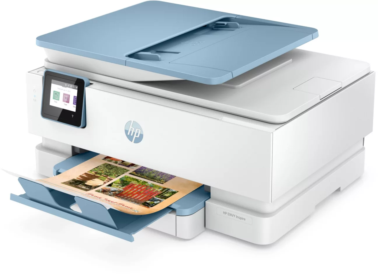 White and blue HP Envy printer with a color printout in the tray, and a light blue scanner lid.