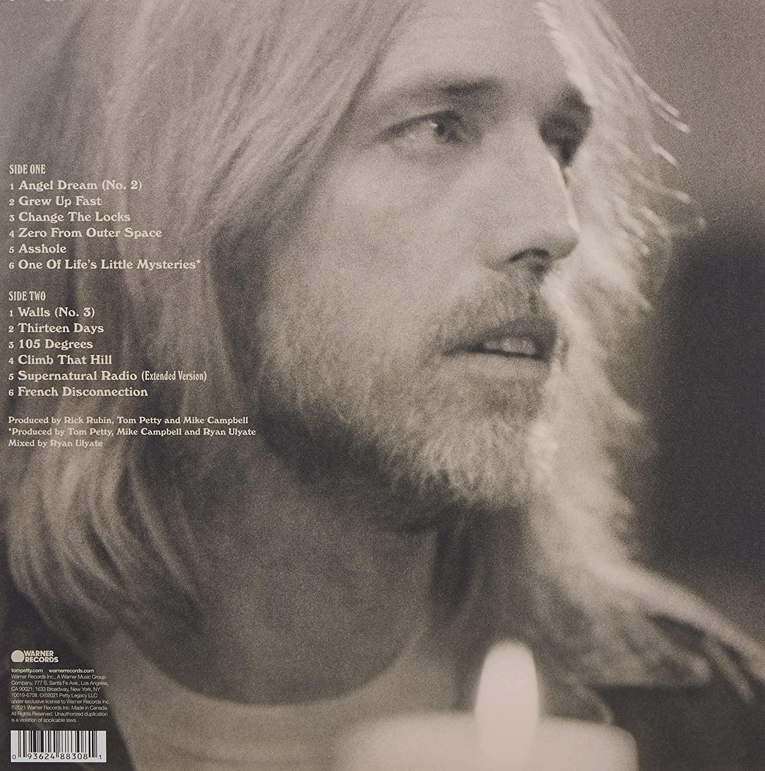 Pochette de l'album de Tom Petty avec son portrait. Liste des titres et logo Warner Records visibles.