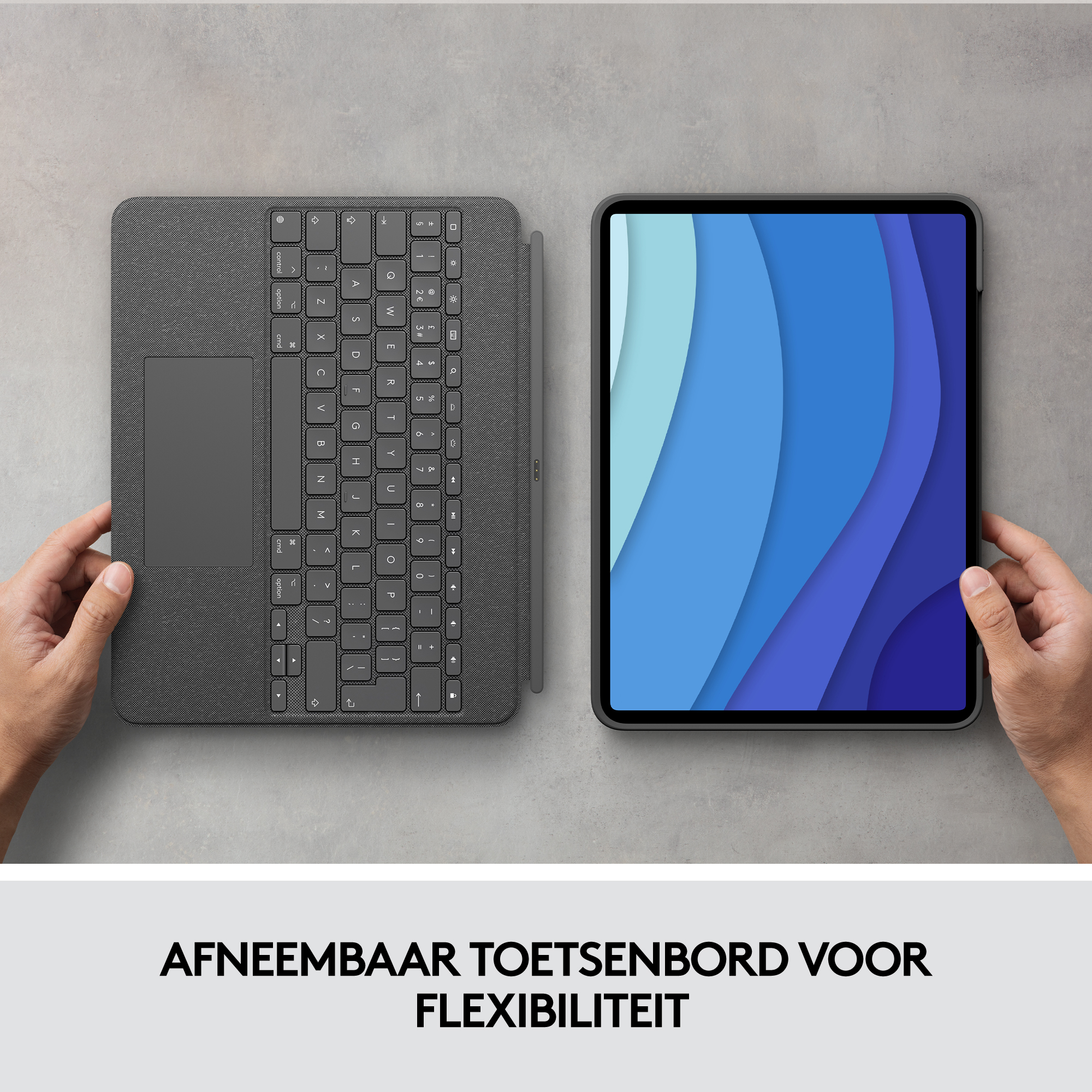 Tablet with keyboard. Grey keyboard with touchpad, and a blue screen. Hands visible.