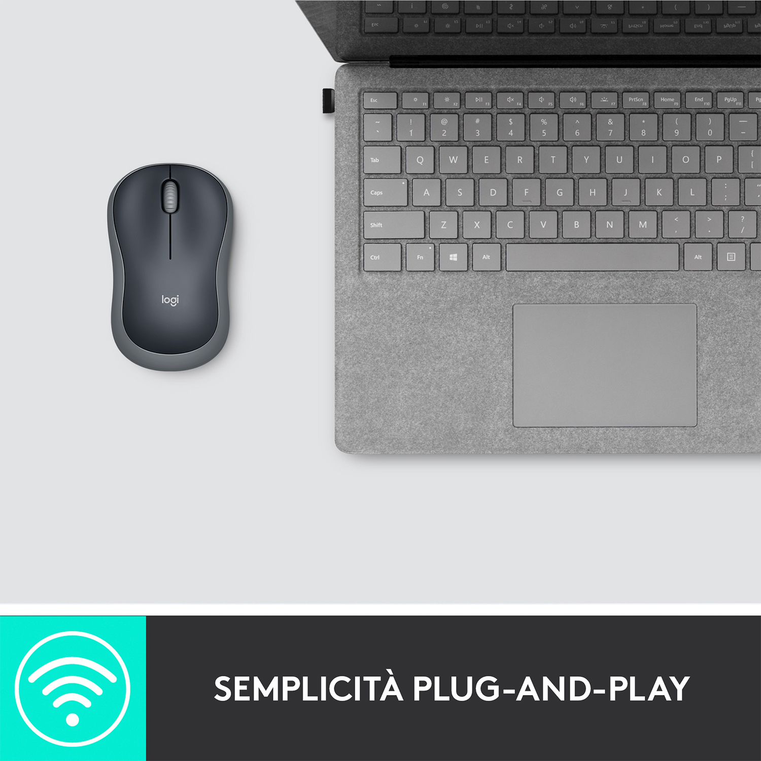 Mouse e tastiera wireless Logi su una superficie grigia. Il mouse è a sinistra.