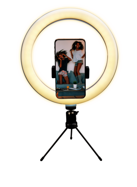 A ring light with a phone in the center, displaying two women. Black background.