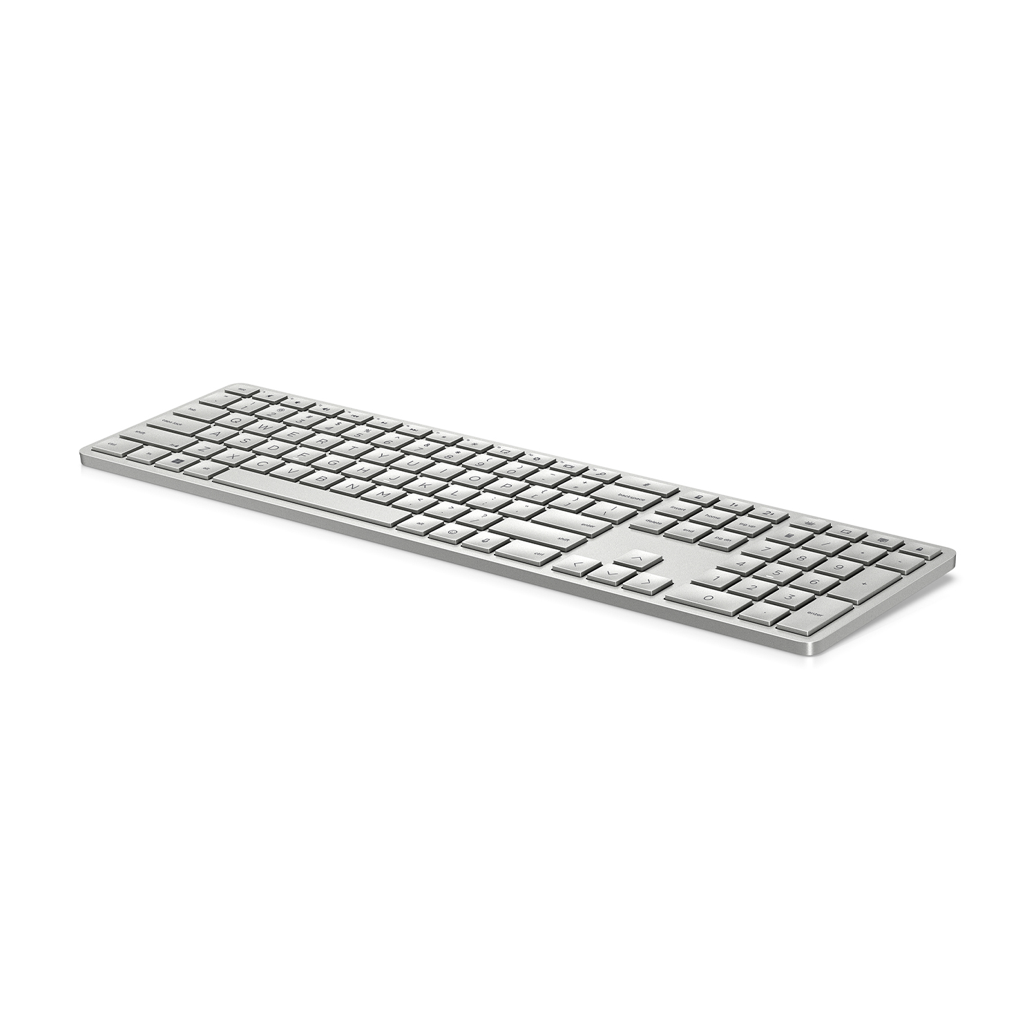Una tastiera argentata con un design semplice e piatto su sfondo bianco.