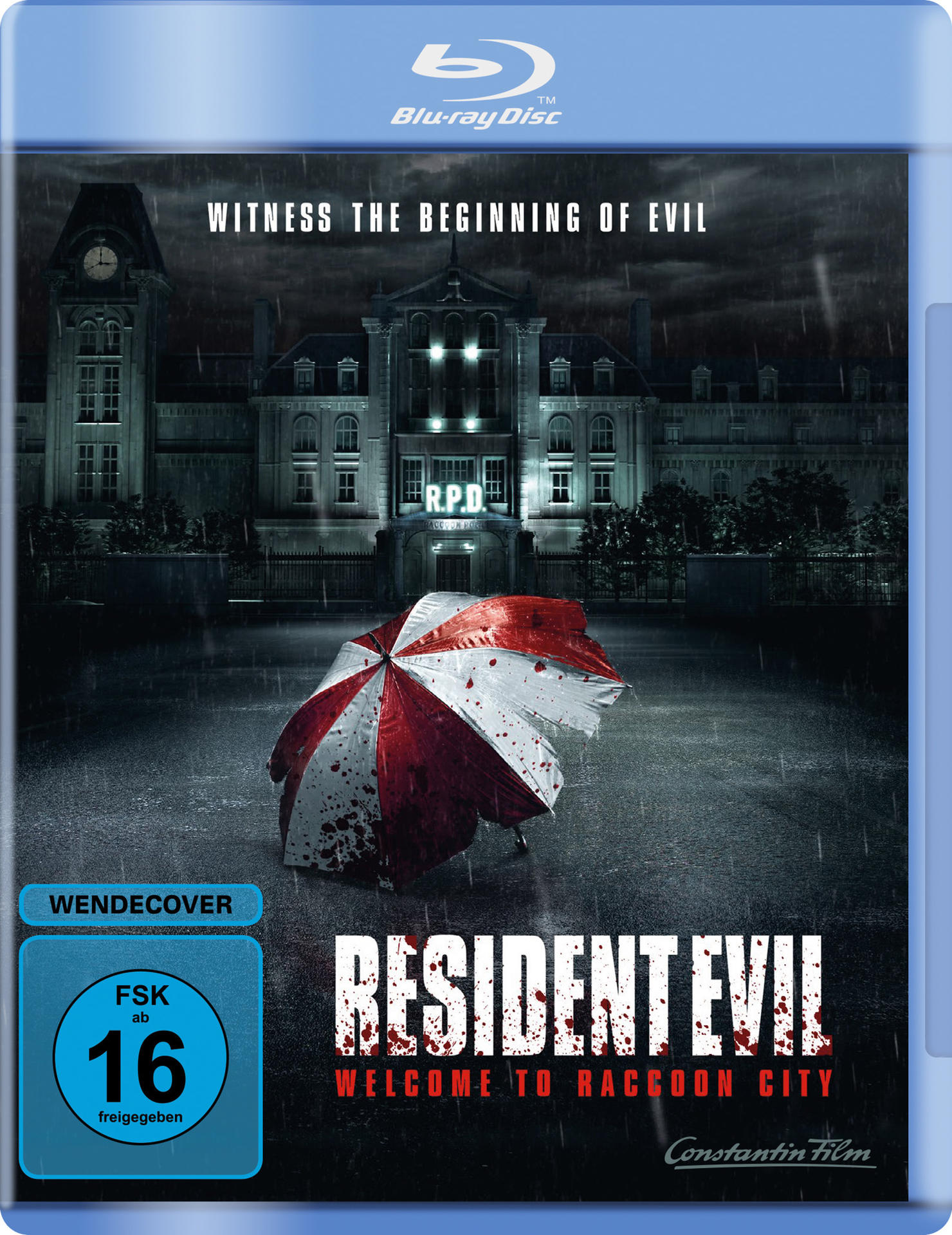 Blu-ray-Cover. Ein Gebäude im Regen, ein Regenschirm mit Blutflecken und Text.