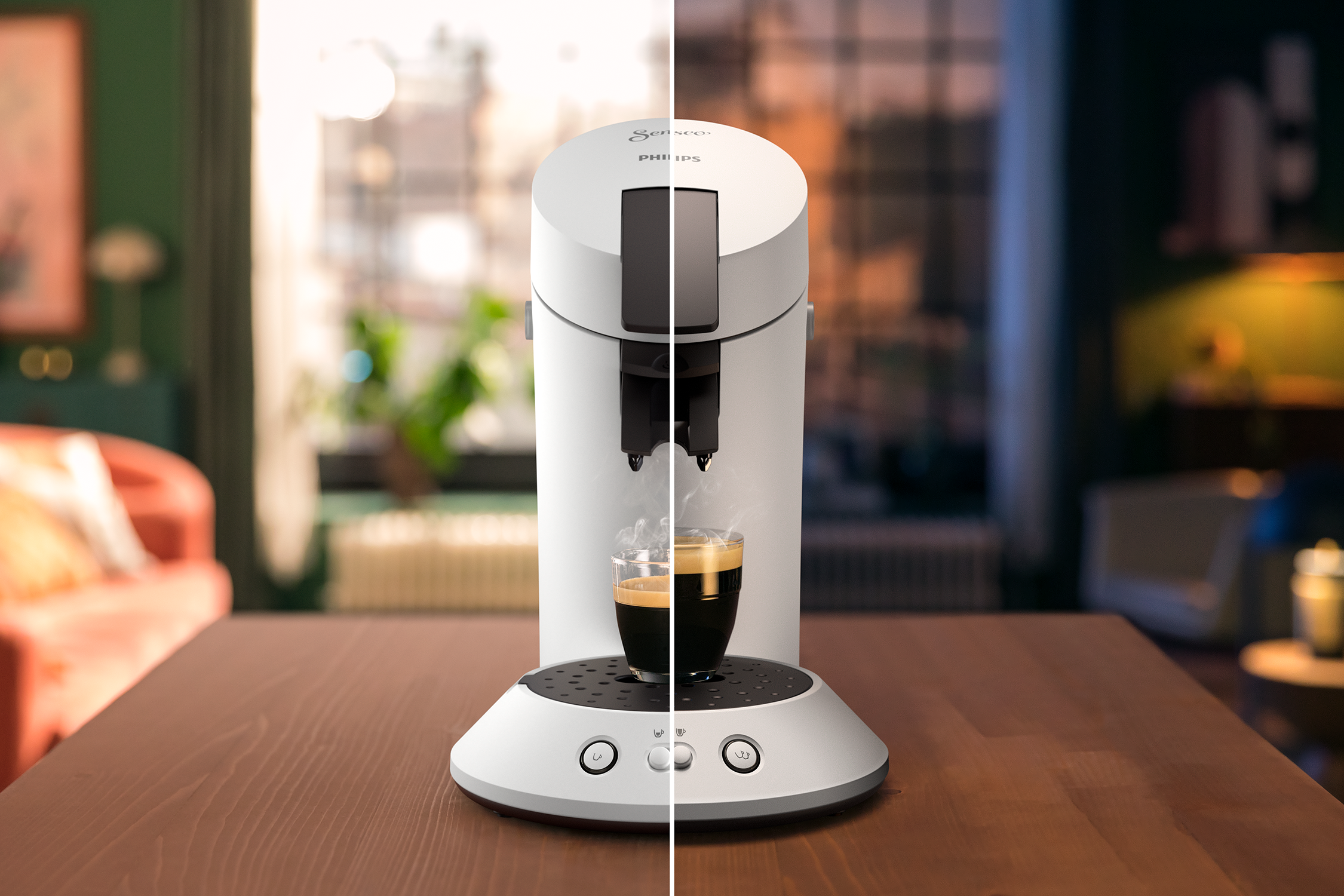 A coffee machine dispensing espresso. The background shows a blurred living room scene.