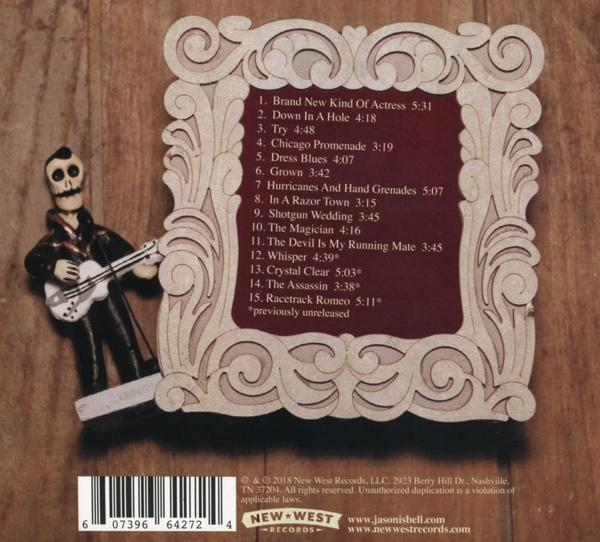 CD-Hülle mit Album-Trackliste und Zeichentrickfigur mit Gitarre. Hintergrund ist ein Holztisch.