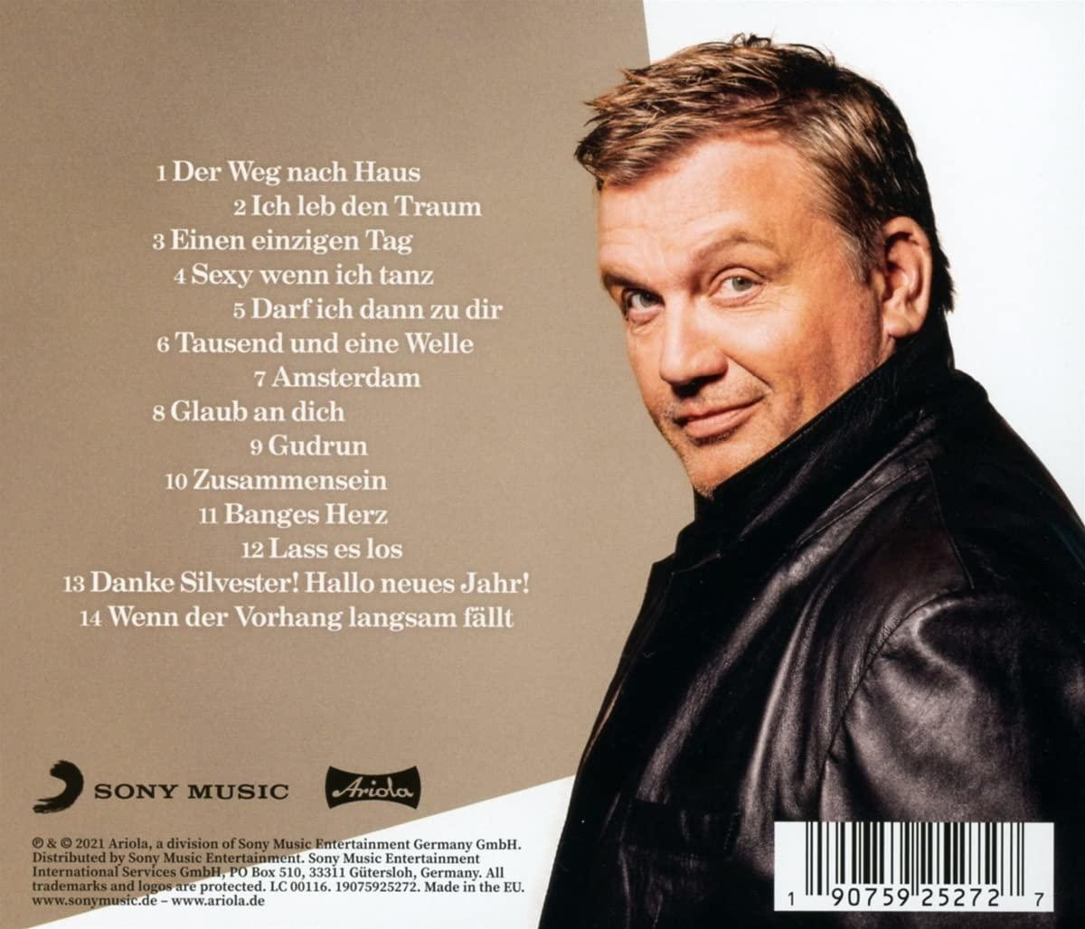 Ein CD-Cover mit dem Gesicht eines Mannes und einer Titelliste.