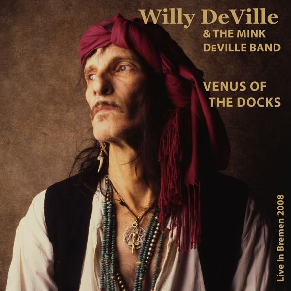 Willy DeVille albumhoes. Toont een man met tulband. Tekst zegt Venus of the Docks.